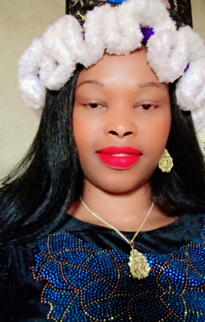 “Umeh Ukamaka Augusta (Amaka Augusta) posing confidently in stylish attire”